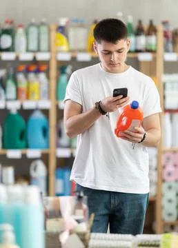 Young man scanning qr code for unclogging gel Stock Photos