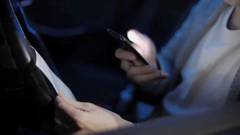 A young man scans the receipts from stores with his mobile application in his Stock Footage 143377388