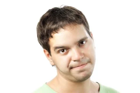 Young man sceptically looking isolated on white background Stock Photos
