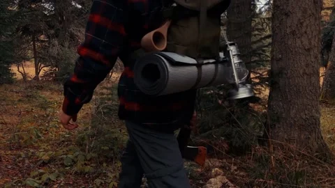 Young man scouting for camping in the forest Stock Footage 165415427