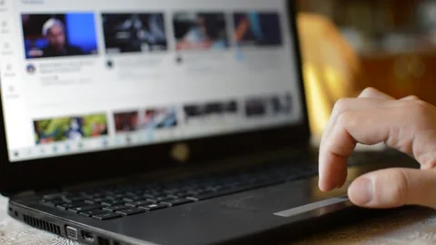 Young man scroll youtube browser on his laptop. youtube laptop communication 스톡 동영상 193989936
