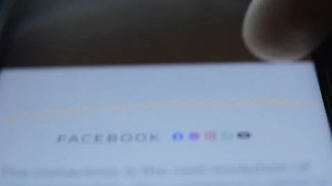 Young man scrolling metaverse internet website on his phone. meta by facebook Video stock 185943014