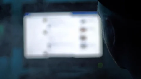 Young man scrolling through social media feed in dark room Stock Footage 118976440