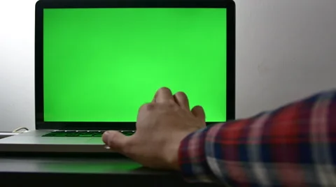 Young Man Searching The Internet Using The Laptop"s Track Pad, Green Screen Stock Footage 64045416