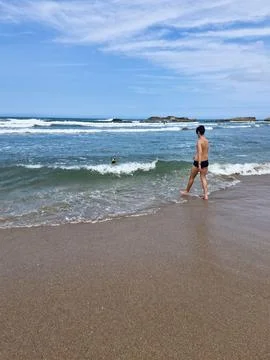 Young man at the seaside Fotos de archivo