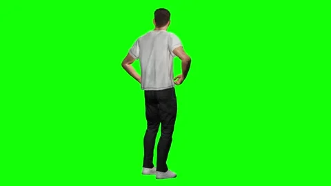 Young man seen from back standing with hands on hips isolated on green Stock Footage 328639547