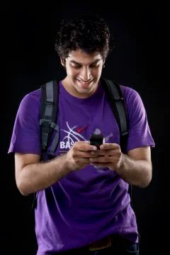 Young man sending a text message Stock Photos