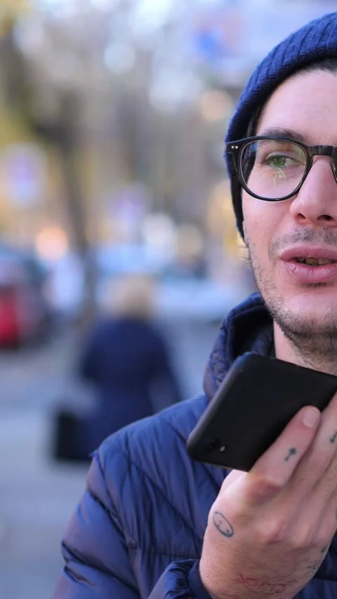 Young Man Sending Voice Message on Cold Winter Day Video stock 293340901