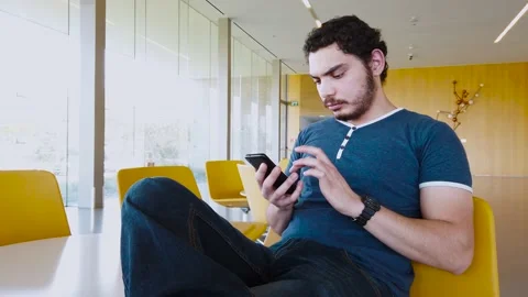 Young man sends a voice message Stock Footage 132803685