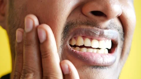 Young man with sensitive teeth Stock Footage 235066409