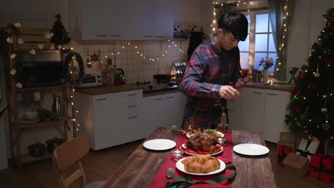 Young man sets beautiful decorated winter table Stock-Footage 163692619
