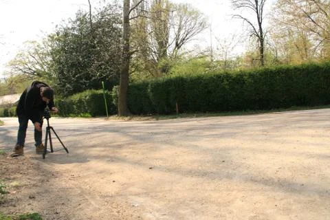 Young Man Setting Up Tripod Stock Photos