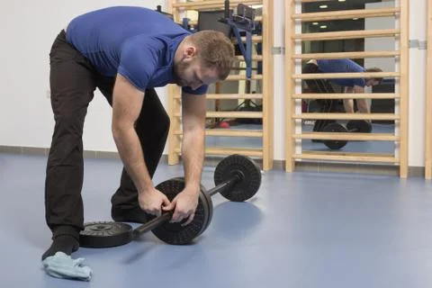 Young man, setting up weights, weight bar Stock Photos