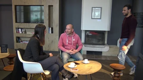 Young Man Settles Down With His Friends Stock Footage 123513054