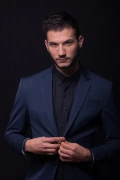Young man sexy suit jacket, black shirt Stock Photos