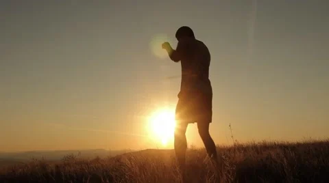 Young Man Shadow Boxing On a Beautiful Sunset Stock Footage 55847434