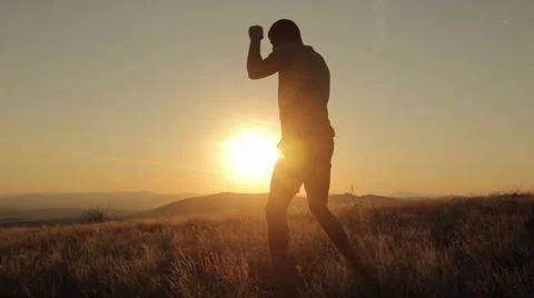 Young Man Shadow Boxing On a Beautiful Sunset Stock Footage 55847822