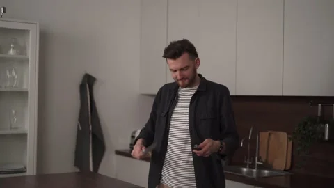 Young man is sharpening his knife before cooking a meal. Stock Footage 169047855