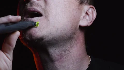 Young man shaving his face with a trimmer for shaving Video stock 308537878