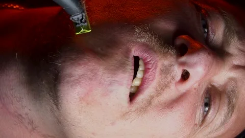 Young man shaving his face with a trimmer Stock-Footage 308538115