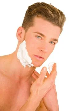 Young man shaving Stock Photos