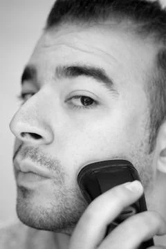 Young Man Shaving Stock Photos