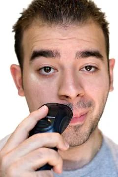 Young Man Shaving Stock Photos