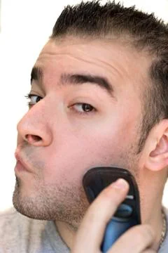 Young Man Shaving Stock Photos