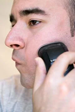 Young Man Shaving Stock Photos