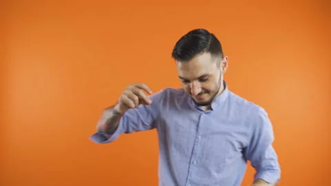 Young man in shirt slow dancing. Smiling man dancing concept Stock Footage 138797681