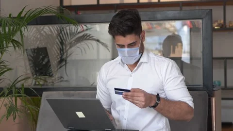 Young man shopping online by using credit card. Видео 145970561