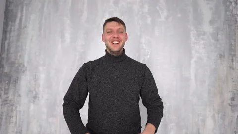 Young man showing double thumbs up, like gesture, demonstrating approval Stock Footage 150876007