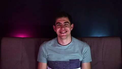 Young man showing grimaces on camera. Front view of a happy caucasian man speaki Stock Footage 131196769