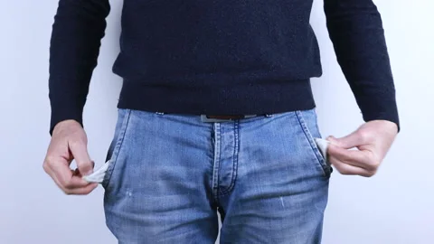 Young man showing his empty pocket, men have financial problems 스톡 동영상 149981401