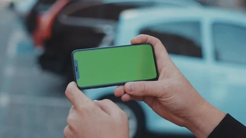 Young man showing in horizontal position modern smartphone with mock-up Stock Footage 117426655