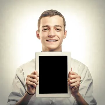Young man showing tablet pc. Stock Photos