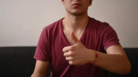 Young man showing thumb up Stock Footage 263252949