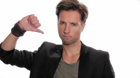 Young man showing thumbs down Video stock 45893897
