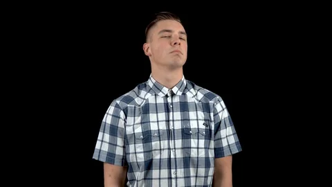 A young man shows emotion a contemptuous look on his face. A man with a scornful Stock Footage 122254324