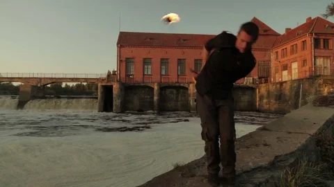 A young man shows a fire show against the backdrop of an old German Stock Footage 81533458