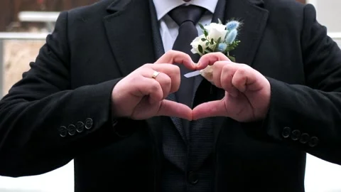 Young man shows hands in the shape of a heart. concept of love and devotion Stock-Footage 260986567