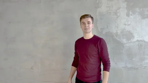 Young man shows a presentation points his hand to 4 positions on the left Video stock 120386994