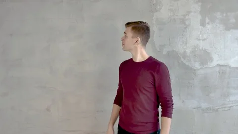 Young man shows a presentation points his hand to 4 positions on the left Video stock 120740843