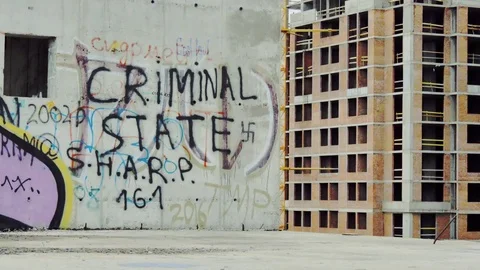 A young man is sick in an abandoned building Stock Footage 82785255