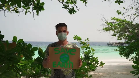 A young man with a sign "Save the Earth" Stock Footage 146652275