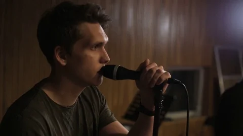 Young Man Singing to the Microphone Stock Footage 72205642