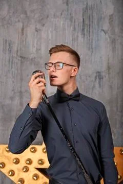Young man singing with microphone Stock Photos