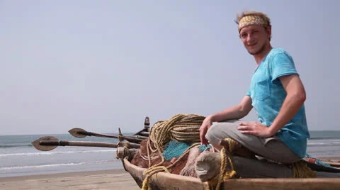Young man sit on the boat Stock Footage 26380552
