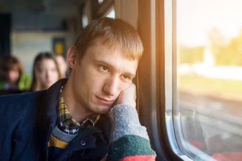 Young Man sit in the Train by the Window Stock Photos