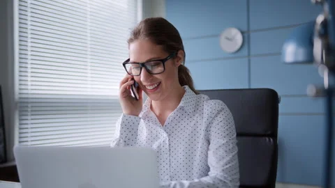 Young man sits at table with laptop in home office Stock Footage 260950471